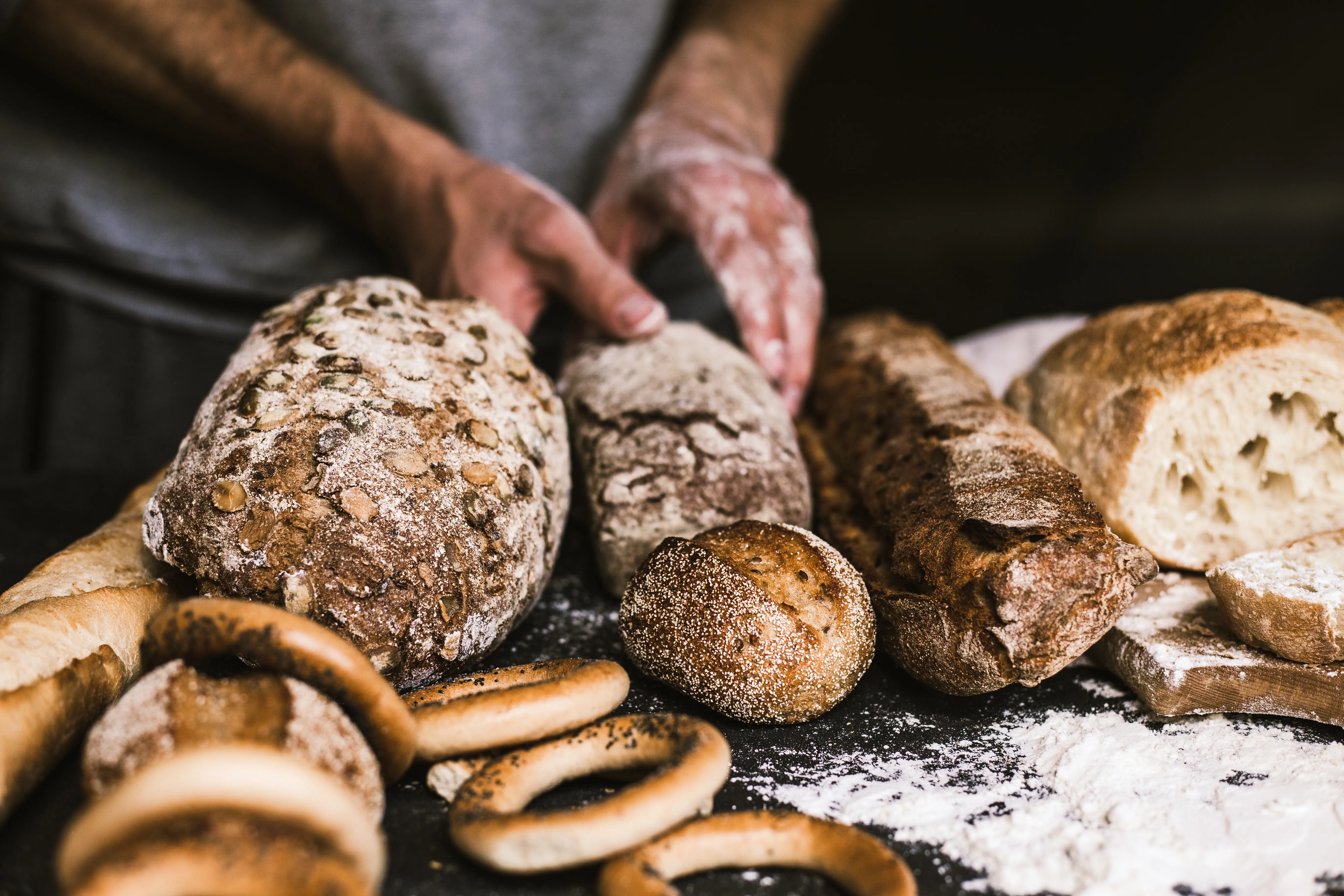 baker-man-holding-rustic-organic-loaf-bread-his-hands.jpg